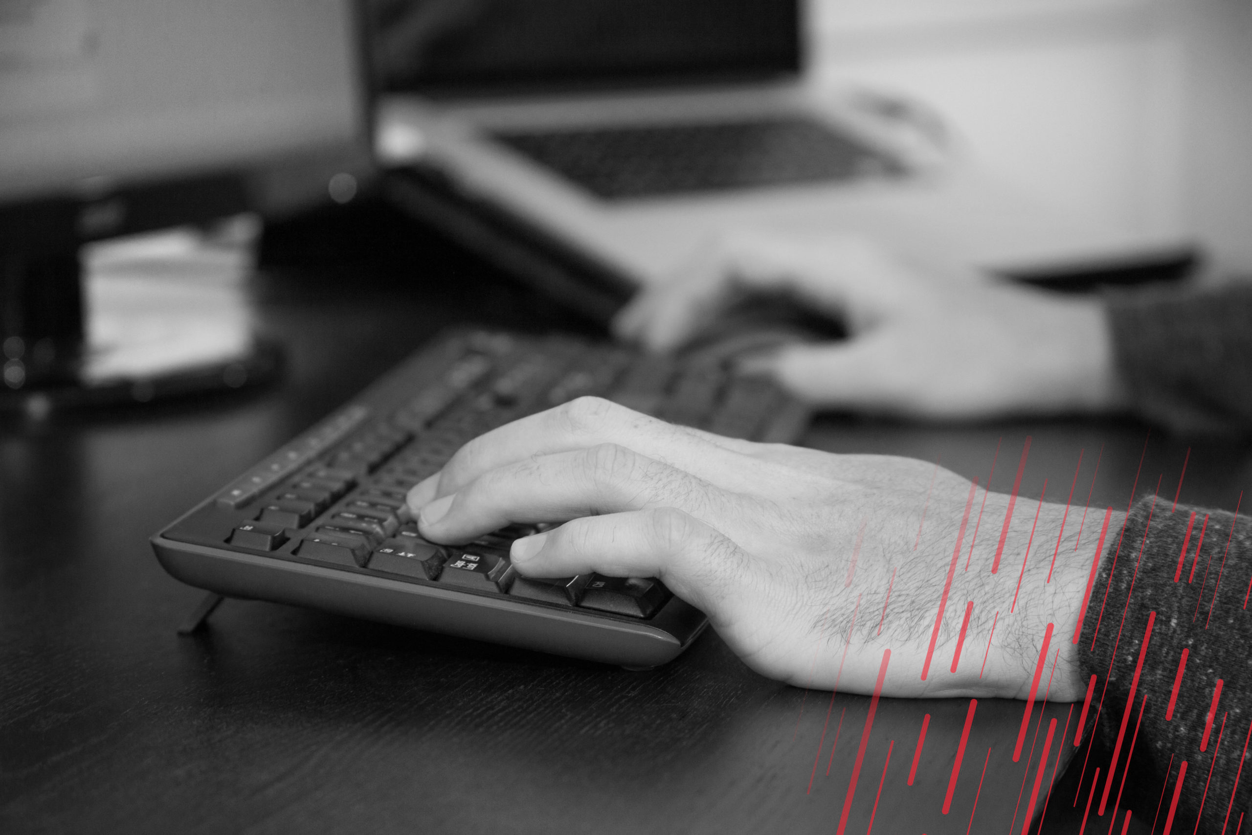 Hands typing on keyboard